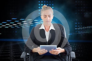 Composite image of businesswoman sitting on swivel chair with tablet