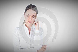 Composite image of businesswoman suffering from headache