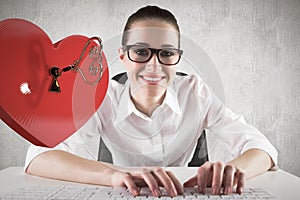 Composite image of businesswoman typing on a keyboard