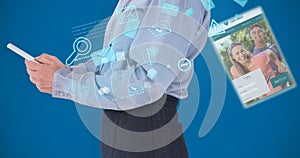 Composite image of businesswoman using her tablet