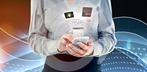 Composite image of businesswoman using smart phone