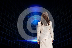 Composite image of businesswoman walking away from camera