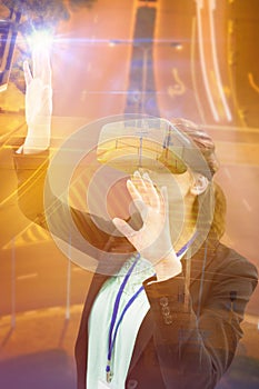 Composite image of businesswoman wearing virtual reality glasses while gesturing