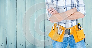 Composite image of Carpenter against blue wood panel