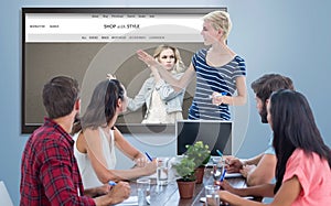 Composite image of casual businesswoman giving presentation to her colleagues