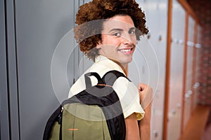 Composite image of casual young man in office corridor