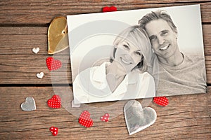 Composite image of cheerful couple in bed