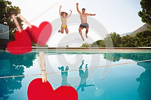 Composite image of cheerful couple jumping into swimming pool