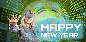 Composite image of cheerful woman using reality virtual headset