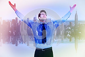 Composite image of cheering businessman with his arms raised up