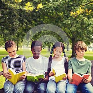 Composite image of children reading books at park