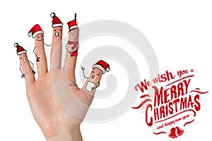 Composite image of christmas caroler fingers