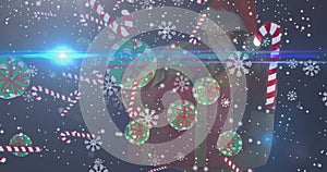 Composite image of christmas decorations over snowy background with copy space