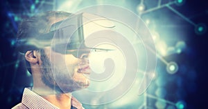 Composite image of close up of businessman holding virtual glasses
