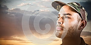 Composite image of close up confident soldier wearing cap