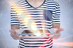 Composite image of close up of man holding tablet