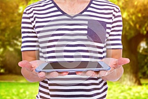 Composite image of close up of man holding tablet