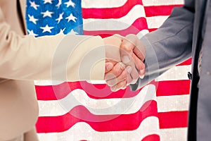 Composite image of close up of people shaking hands