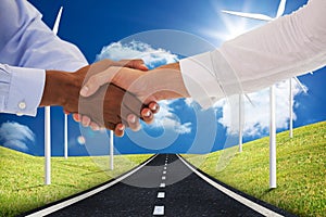 Composite image of close-up shot of a handshake in office