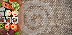 Composite image of close up of sushi served in wooden plate