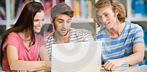 Composite image of college students using laptop in library