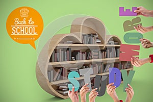 Composite image of colorful alphabet spelling study more held up by people