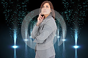 Composite image of concentrating businesswoman