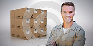 Composite image of confident delivery man standing with arms crossed