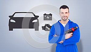 Composite image of confident handyman holding power drill