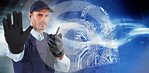 Composite image of confident security officer making stop gesture