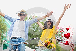 Composite image of couple on bike and valentines hearts 3d