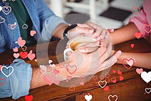 Composite image of couple hands and valentines hearts 3d