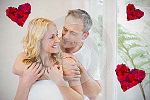 Composite image of couple and hearts 3d