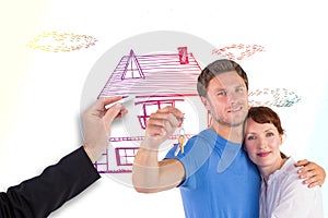 Composite image of couple holding keys to home