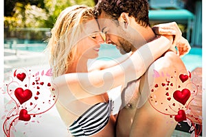 Composite image of couple in pool and valentines hearts 3d