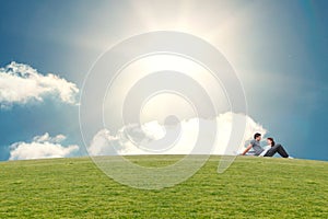 Composite image of couple sitting on the floor