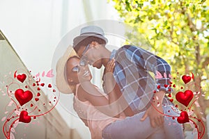 Composite image of couple and valentines hearts 3d