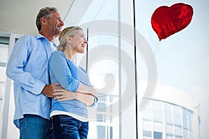 Composite image of couple and valentines hearts 3d