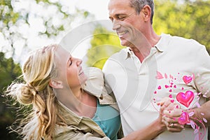 Composite image of couple and valentines hearts 3d