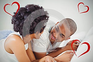 Composite image of couple and valentines hearts 3d