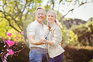 Composite image of couple and valentines hearts 3d