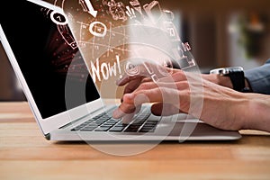 Composite image of cropped image of businessman typing on laptop