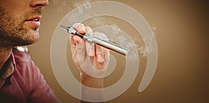 Composite image of cropped image of man smoking electronic cigarette