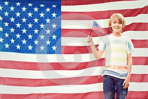 Composite image of cute boy with american flag