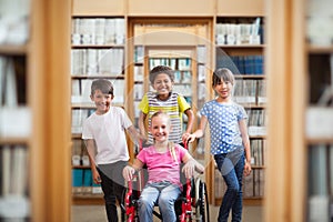 Composite image of cute disabled pupil smiling at camera with her friends