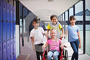 Composite image of cute disabled pupil smiling at camera with her friends