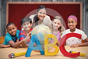 Composite image of cute pupils and teacher looking at globe in library