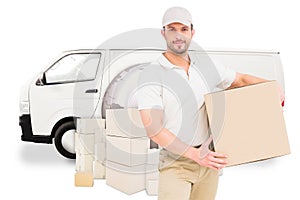 Composite image of delivery man carrying cardboard box