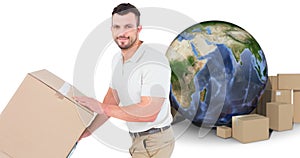 Composite image of delivery man pushing trolley of boxes