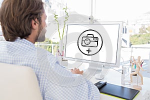 Composite image of desinger working on his computer
